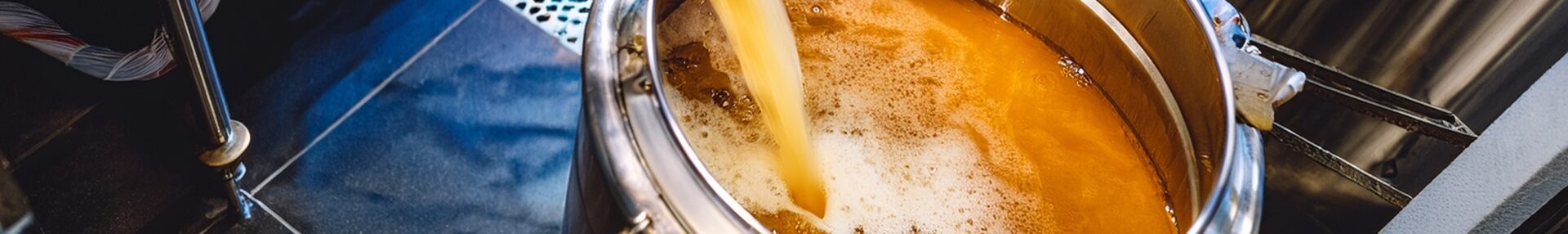 Beer Being Poured into a Vat Banner Sized